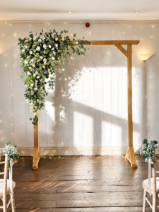 The Chilli Barn wooden arch rustic wedding flowers at the chilli barn otley