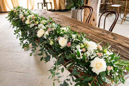 Tithe Barn tithe barn ceremony table flowers wedding